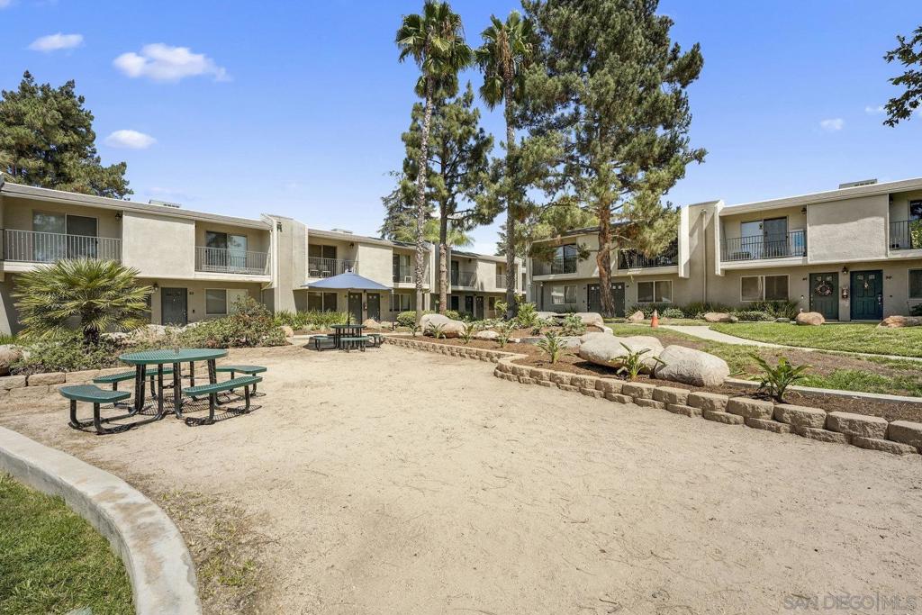 Welcome to this charming 1-bedroom, 1-bath condo located in the gated community The Village Townhomes in El Cajon. This desirable end-unit offers added privacy and features a spacious patio that spans the width of the condo, accessible via sliding doors from the living room and bedroom. Inside, the living area flows seamlessly from a spacious dining area to the kitchen, featuring granite countertops, maple cabinets, and stainless steel appliances, and then to the open living room. The well-maintained community includes a sparkling pool, a grilling area, an exercise room, and a recreation area. The home also includes one assigned parking space inside the gated lot. Conveniently located near shopping, dining, major freeways, and close proximity to schools.