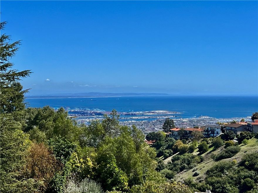Modern Ranch Home Built in 1999 by the current owners from the ground up. This home has all of the space and amenities anyone could want! With privacy and views of the Harbor Breakwater and Ocean, Long Beach City Lights and Coastline to the south, one will see glorious sunrises. With 1.7 acres of usable land, this home features a private guest house (fully equipped with a cozy fireplace, separate bedroom, bathroom and laundry), bocce ball court, swimming pool with spa, gardens and paths, orchard and grassy yard and the potential to build a barn. With over 6000 sgft of outside patios and porches that overlook the views and grounds, visitors are drawn outside through large glass walls of windows, to enjoy the serenity of mature trees and landscaping. Enter into the home through a covered veranda and you are greeted with warm wood flooring and wood ceilings with a neutral color palette that were inspired by a love of Big Sur. Inside you will find gracious open entertaining spaces with large stone fireplaces. The kitchen is in the heart of the home and accesses both the Living, Dining and Family rooms (with a wet bar and pool table). There is a large library with walls of woodwork shelves and a fireplace to relax in front of and read. The primary bedroom overlooks the views and is ensuite to a large bathroom featuring his and hers closets, dual vanities, soaking tub and skylights. Down a hand crafted spiral staircase, there is a finished basement ready to customize a wine room and media room. Enjoy the existing mirrored dance or exercise room which is ready to go. There is also a large bathroom that leads out to the spa and pool. There is a workshop next to the oversized three car garages. Community schools are excellent and within the Equestrian inspired City of Rolling Hills are 26 miles of trails, two riding rings and tennis and pickleball courts. With 3 separate 24/7 attended gates, Rolling Hills offers less traffic while enjoying incredible views and a rural lifestyle. Easy access to all other Southbay and Los Angeles cities for dining and beaches. The Palos Verdes Peninsula also offers local shopping and dining options and incredible parks and vistas from them all!