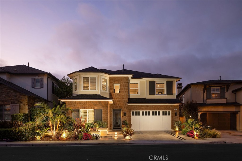 Located in one of the most desirable areas of the Brightwater community in Huntington Beach, this Seaglass 4-bedroom, 4.5-bathroom former model home has been extensively renovated with high-end finishes and thoughtful designer upgrades throughout. From enhanced exterior details to a luxurious, light-filled interior, this home offers an elevated lifestyle in a premier coastal setting. Upon entry, you’re welcomed by elegant wainscoting and a custom-designed staircase that reflect the home’s architectural sophistication. High ceilings and large windows create an airy, open feel, complemented by designer tile flooring downstairs and rich hardwood floors upstairs. The spacious family room showcases a custom fireplace with a designer accent wall, seamlessly flowing into the chef’s kitchen and California room. The kitchen is a showpiece, complete with professional-grade appliances, custom cabinetry, an oversized island, and curated finishes ideal for entertaining or everyday living. Also on the main level are a formal dining room with a bold designer ceiling, a private home office, and an en-suite mini master—perfect for guests. The California room expands the living space outdoors, leading to a serene Zen-style backyard with a built-in BBQ, private spa, and peaceful landscaping—perfect for alfresco dining or quiet relaxation. Upstairs features a spacious bonus room with another custom accent wall, ideal for a playroom, lounge, or gym. The primary suite is a true retreat with high ceilings, a second custom fireplace, a third designer wall, and a spa-inspired bath featuring dual vanities, a soaking tub, walk-in shower, and a custom-built walk-in closet with high-end built-ins. Each secondary bedroom includes its own en-suite bath and stylish details. Additional features include designer window coverings, upgraded lighting throughout, a whole-house water softener system, and a spacious 3-car garage. Enjoy access to the scenic Bolsa Chica Wetlands trail system, offering stunning walking paths with views of the Pacific Ocean, and five pocket parks within the community. Community amenities include the private Brightwater Clubhouse with a lap pool, spa, fire pit, BBQ area, and gym with exercise equipment—just a short stroll from your front door.