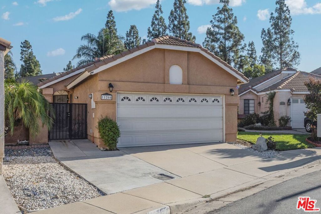 Great single family residence with 2 spacious bedrooms ,1 bath and a powder room. Living room with gas fireplace that opens to the patio. Kitchen with built-in microwave, plenty of cabinets/storage and dining area that leads to the attached 2-car garage. Enjoy entertaining in the backyard where you can BBQ or just relax under the Pergola. There is central air/heat and washer & dryer hookups in the garage. Minutes to Victoria Park and conveniently located near the 210 freeway, schools, restaurants and shops.