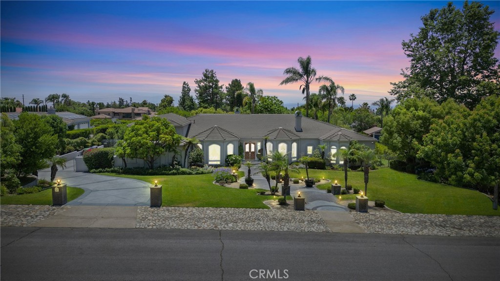 An Extraordinary North Claremont Estate. Nestled in one of the most exclusive enclaves of North Claremont, this sprawling, custom-built residence is a true architectural masterpiece, offering an unparalleled blend of luxury, sophistication, and comfort. Resting on an expansive 35,047 sq. ft. estate lot, this home features 6,581 sq. ft. of thoughtfully designed living space, seamlessly blending timeless elegance with modern functionality. From the moment you arrive, the grand double-door turret entry welcomes you into an extraordinary formal foyer, showcasing custom-carved designer glass wall and artful architectural details. The formal living room is a statement of refined taste, with exquisite paneled walls, soaring ceilings, and bespoke window treatments that bathe the space in natural light. The formal dining room is perfect for elegant entertaining, highlighted by built-in display cabinetry, while the executive library/office boasts floor-to-ceiling custom woodwork, a stately desk, bookcases, and a richly detailed coffered ceiling. At the heart of the home lies the expansive family room w/a custom full wet bar open to a one-of-a-kind gourmet kitchen w/custom built-ins, sub-zero,. An add'l catering/prep kitchen w/six-burner+ cooktop, professional-grade double ovens, sub-zero, and so much more - Ideal for hosting large gatherings. Upstairs bonus entertainment room accommodates billiards, poker, or intimate social evenings. The primary suite is a serene retreat, offering a large private sitting room w/fireplace, a luxurious en suite bath with dual vanities, a soaking tub, a walk-in glass shower, and an impressive custom-designed walk-in closet with extensive built-ins. 3 add'l bedrooms, each w/en suite baths, provide exceptional accommodations for family and guests. The grounds of this estate are nothing short of breathtaking—meticulously landscaped with mature greenery, a sparkling pool and spa, and an outdoor covered kitchen and barbecue pavilion designed for year-round enjoyment. A 1 bedroom, 1 bath guest quarters/ADU offers additional private living space, perfect for extended family or visitors. Add'l amenities include a three-car oversized attached garage, gated RV parking, and an automated self-closing driveway gate ensuring both security and convenience. This is more than a home—it is a lifestyle, a statement, and a rare opportunity to own one of Claremont’s most distinguished residences. Opportunities of this caliber seldom present themselves.