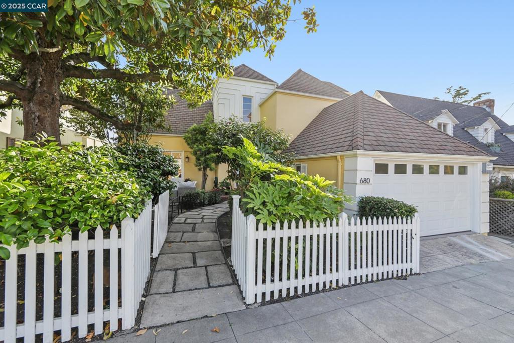 Price Improvement for this EDWIN LEWIS SNYDER architectural master piece! Commanding breathtaking, panoramic views of San Francisco and the Golden Gate, Bay, and Richmond Bridges, this exquisite 1936 residence offers a harmonious blend of timeless elegance and modern luxury in the coveted Berkeley Hills. A private, white picket fenced courtyard with stone pathways sets the stage for this architectural gem. Step inside to a dramatic two-story foyer and discover a meticulously updated interior featuring a chef's kitchen, complete with Thermador appliances, wine refrigerator, workstation sink and Anderson windows with stunning Bay views. Refined details in the living and dining rooms include white oak flooring, wainscoting, and tongue-and-groove ceilings, enhanced with automated controls for many of the home systems. Seamlessly transition through French doors from the living room with captivating vistas of San Francisco to the serene patio beneath a majestic magnolia tree. All upstairs bedrooms boast enviable Bay views, while the primary suite offers a luxurious retreat with an en-suite bathroom and a custom walk-in closet. The versatile lower level provides additional living space with a family room, fourth bedroom/office, and a level backyard perfect for entertaining.