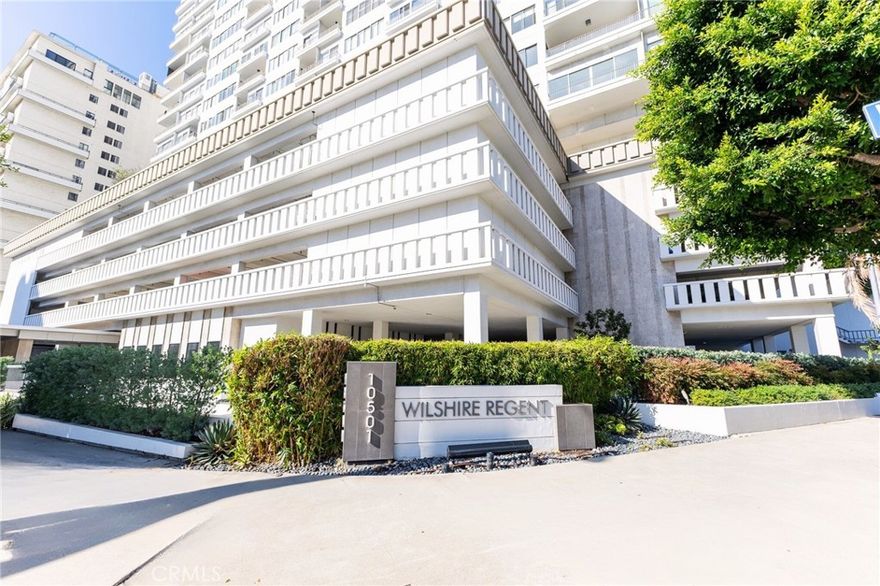 Stunning 14th-Floor Corner Residence with Panoramic Views on the Wilshire Corridor. Welcome to the Wilshire Regent, a premier full-service luxury condominium on the famed Wilshire Corridor, also known as Millionaire's Mile, moments from Westwood Village, UCLA, Holmby Park, and Century City. This spacious 2-bed, 2-bath residence (approx. 1,380 sq. ft.) is a rare end-unit featuring private north- and south-facing balconies with unobstructed views, abundant natural light, and both sunrise and sunset vistas. Located on the 14th floor, the home features bamboo flooring throughout, upgraded double-pane windows, recessed lighting, custom closets and cabinetry, and enhanced storage. The living room, kitchen, and primary suite feature in-ceiling speakers, subwoofers, and dual home-theater receiver systems for an elevated audio and entertainment experience. The Wilshire Regent is a full-service building offering 24/7 doorman, valet, security, and on-site management, with a highly experienced long-term staff that creates a safe, welcoming, and well-run residential environment. Residents enjoy a modern fitness center, outdoor heated pool on the mezzanine level, conference and social rooms, EV charging stations, and secure indoor parking with two non-tandem parking spaces reserved for this unit. Additional conveniences include guest suites, rentable office space for residents (subject to availability), and community laundry facilities with two washers and two dryers on each floor, plus a larger laundry center on the 5th floor. Positioned on the northwest corner of Wilshire & Warner, the building offers some of the most effortless ingress and egress on the Corridor, along with exceptional walkability. Westwood Village, UCLA, Holmby Park, and Westfield Century City are all within close reach, with quick access to Beverly Hills, Brentwood, Santa Monica, LAX, the 405, and the 10. Built on solid ground in the 1960s, the Wilshire Regent has an excellent structural history, having sustained no significant damage in major earthquakes. This rare, view-filled residence unites luxury services, elegant living, and prime Westside convenience, with an exceptional leasing opportunity on Los Angeles' most distinguished high-rise boulevard.