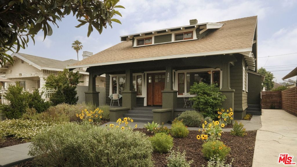 Exceptionally spacious and beautifully remodeled, this historic gem in the Jefferson Park HPOZ neighborhood blends timeless Craftsman charm with modern comfort. Offering 5 bedrooms and a thoughtful floor plan, the home provides abundant space for living, working, and entertaining without sacrificing warmth or character .The exterior showcases authentic Craftsman colors, a wide, welcoming porch, and drought-tolerant native landscaping. A long driveway offers convenient off-street parking. Inside, natural light floods the open, airy layout. The freshly remodeled interior features a neutral palette, perfect for personalizing. The main level boasts an open-concept dining area, family room, and stylish kitchen, plus four bedrooms and three updated bathrooms. Upstairs, you'll find another expansive bedroom, a large second family room, and two versatile landing areas ideal for a home office, reading nook, or creative studio. Step outside to your private backyard oasis with two spacious decks designed for entertaining and relaxing. Lush, thoughtful greenery enhances the sense of retreat. The detached garage, currently offering two additional parking spaces, holds exciting potential for an ADU conversion .Additional upgrades include paid-off solar panels, updated systems, foundation improvements, and more. Perfectly situated near the local library, parks, and neighborhood favorites like Caf/5, South LA Caf, Harold & Belle's, and Highly Likely with easy freeway and public transit access.