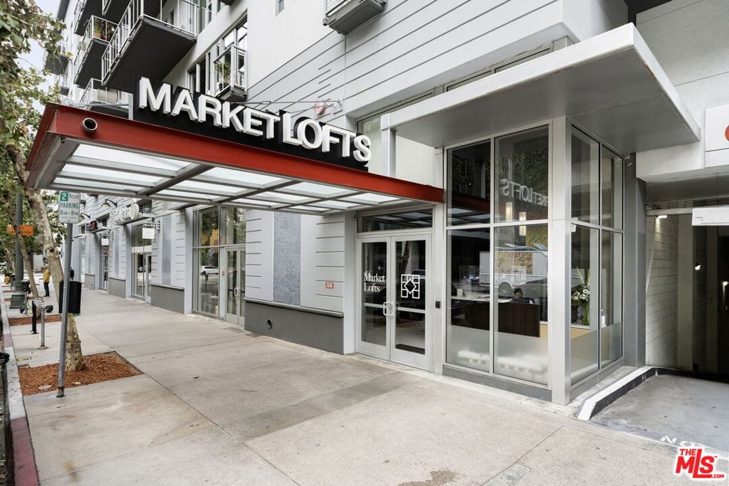 Spacious, one-bedroom loft in the heart of South Park in Downtown Los Angeles. This unit is one of the largest one bedrooms, and one of the most desirable floor plans at Market Lofts. Engineered hardwood floors seamlessly flow down a long entry hall with an alcove bedroom and spacious walk-in closet to your left and continues toward a true chef's kitchen boasting stainless-steel appliances with a gas range, and an abundance of cabinet storage. Live/work in the gorgeous living room and get fresh air and sunshine from the balcony overlooking the pool. BBQ grilling station, resident's lounge with a full kitchen and billiards table, newly remodeled theater screening room, fitness center, package storage lockers, massive loading dock, on-site management, and 24-hour security. Incredible location above Ralphs and only blocks away from Whole Foods, Target, The Bloc, FIGat7th, Metro Station (7th & Metro), FIDM Campus, LA Live, Crypto.com Arena, and incredible bars and restaurants.