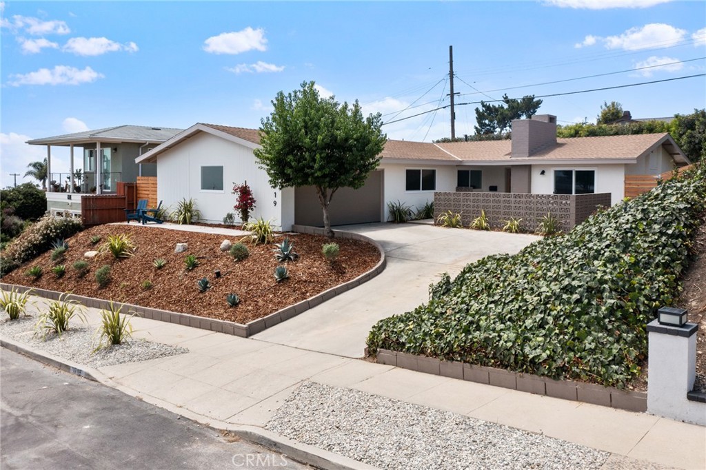 Experience coastal elegance in this beautifully remodeled 4 bedroom, 2 bathroom home located in the prestigious upper South Shores neighborhood of San Pedro. Every detail of this home, which offers nice ocean and LA Harbor views, has been tastefully updated and thoughtfully reimagined, blending sophisticated design with modern functionality. The open concept living space features new luxury vinyl flooring, recessed lighting, and flows seamlessly into the chef’s kitchen, showcasing quartz counters, custom cabinetry, and high quality appliances that include a built-in microwave and stainless refrigerator. The primary suite offers a private ensuite bath, including a dual sink vanity and beautiful walk in shower with glass enclosure. The three additional bedrooms provide versatility for a growing family, guests, office space, etc. Another full bath includes a dual sink vanity and offers a tub/shower combo with access to the pool and side yard. Easy access to your beautifully landscaped, resort-style backyard with sparkling pool and patio area is made easy through the kitchen and dining room area. Living room with stylish brick fireplace also opens to an enclosed courtyard patio at the front of this lovely home. Some of the many great finishes include: new windows and sliders, nw electrical panel and outlets, tankless water heater, new baseboards and moldings, custom lighting, doors, etc. Located in one of San Pedro’s most desirable neighborhoods, you're just minutes from coastal hiking trails, beaches, the upcoming West Harbor Waterfront Development, and local shops and restaurants. Move-in ready and full of charm, this gem is ready to welcome its next owners.