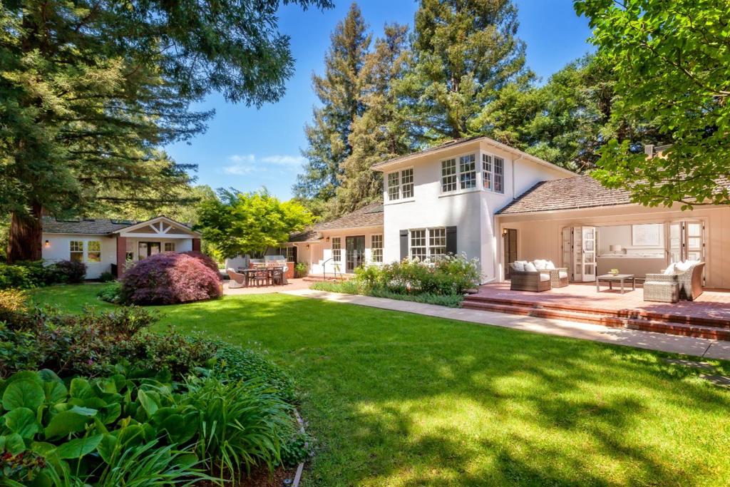 Understated elegance outside with extensively remodeled interiors result in a sophisticated and timeless style on one of Atherton's finest streets. Refinished hardwood floors on both levels, freshly painted interior and exterior, crown moldings, beadboard wainscot and designer lighting. Formal living and dining rooms. Stunning Carrara marble kitchen with Viking appliances, built-in casual dining, large island, and open family room. 3 bedrooms and 3.5 baths include main and upper-level master suites, heated bathroom floors, clawfoot tub, and organized closets. Beautiful 2-bedroom, 1-bath guest house with full kitchen and its own laundry. Detached 3-car garage with storage area and work shop. Magical gardens with roses, vast lawn, separately fenced pool and spa, private patios, barbecue center, fenced vegetable garden, and play area on almost one acre. Just over one-half mile from the Menlo Circus Club.