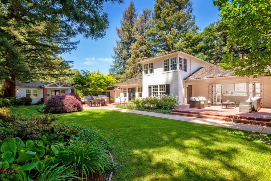 Understated elegance outside with extensively remodeled interiors result in a sophisticated and timeless style on one of Atherton's finest streets. Refinished hardwood floors on both levels, freshly painted interior and exterior, crown moldings, beadboard wainscot and designer lighting. Formal living and dining rooms. Stunning Carrara marble kitchen with Viking appliances, built-in casual dining, large island, and open family room. 3 bedrooms and 3.5 baths include main and upper-level master suites, heated bathroom floors, clawfoot tub, and organized closets. Beautiful 2-bedroom, 1-bath guest house with full kitchen and its own laundry. Detached 3-car garage with storage area and work shop.  Magical gardens with roses, vast lawn, separately fenced pool and spa, private patios, barbecue center, fenced vegetable garden, and play area on almost one acre. Just over one-half mile from the Menlo Circus Club.