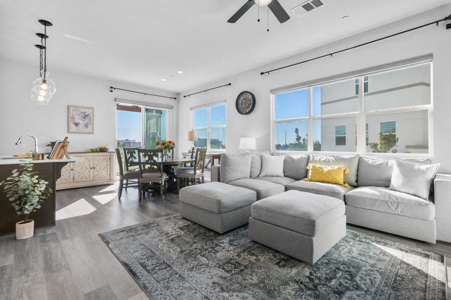 Step into the lifestyle you’ve always dreamed of in this stunning 3-bed, 3-full-bath END-unit townhome with a TWO-car garage that blends modern design with everyday comfort. Oversized windows on two sides face an unobstructed open area outside, and its soaring ceilings fill the home with light, creating a bright, airy atmosphere that instantly welcomes. The large modern, beautifully appointed kitchen, dining, and living room area soars with its 10-ft ceilings! The luxurious primary suite features dual sinks and a spacious walk-in closet, with every detail thoughtfully designed for both style and function. Sleek finishes, a front balcony, stainless-steel appliances, an attached TWO-car oversized garage, and generous storage make this turnkey home as practical as it is beautiful. But the real magic happens beyond your door. Enjoy resort-style amenities every day—sparkling pool and in-ground spa, lush courtyards with BBQs, eating tables, pickleball and tennis courts, ping pong and foosball tables, playgrounds, and peaceful green spaces perfect for relaxing or entertaining. Just beyond, you’re surrounded by the best of Otay Ranch Town Center: boutique shopping, trendy restaurants, movie theater, and a supermarket, all just moments away in a vibrant community designed for connection and convenience. A world unto itself—don’t miss it!