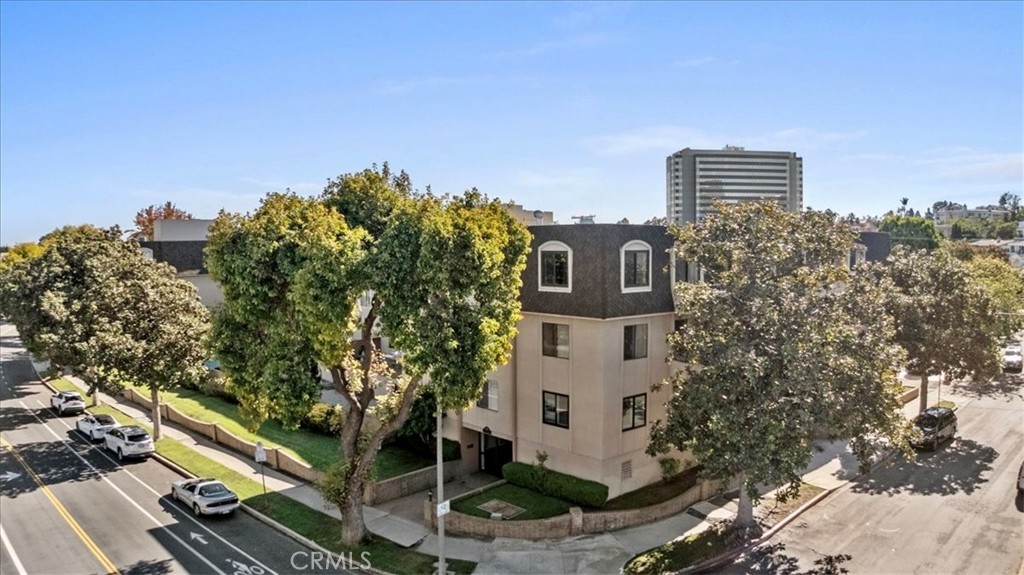 Spacious and bright condo in a prime Beverly Hills adjacent location with an incredibly walkable setting. This 2 bedroom, 2 bath home boasts 1,520 square feet of comfortable living space and is located in Unit 106, one floor above ground level for added privacy and security. The oversized balcony is lined with custom cut bamboo, creating a peaceful outdoor retreat ideal for relaxing or entertaining. Inside, you’ll find new flooring throughout, a fireplace, wet bar, and in unit washer and dryer. Recent upgrades include a new dishwasher, gas range, under cabinet range hood, light fixtures, faucets, toilet, and vanities. The smart layout places bedrooms on opposite sides for enhanced privacy, and the second bedroom has its own private entrance. Community amenities include a pool, spa, fitness room, and sauna, with controlled access and two parking spaces in the gated garage on the ground floor, offering direct, step free entry. Central heating and AC provide year round comfort. The location is unbeatable, just moments from Century City, Roxbury Park, Rancho Park, Hillcrest Golf Course, and world famous Beverly Drive. This one truly checks all the boxes