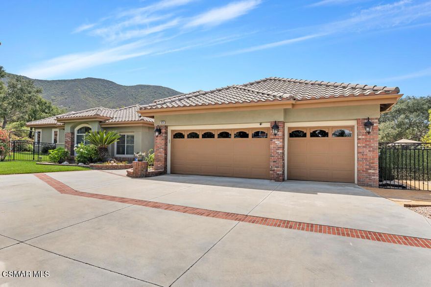 This private, single-story estate in Newbury Park offers a rare blend of timeless design, natural beauty, and lifestyle flexibility-set on over three-quarters of an acre. Tucked behind a long private drive with potential for gated access, this 4,417 sq ft residence delivers expansive single-level living, indoor-outdoor flow, and stunning mountain views.The backyard is a true retreat, backing to open space with multiple patios, a sparkling pool and spa, and a 740 sq ft covered pavilion with fireplace, TV hookups, and built-in outdoor kitchen. Fruit trees, garden beds, and mature landscaping complete the experience.Inside, wide-plank hardwood and slate tile floors connect generous living and dining spaces. The kitchen offers ample storage, a large granite island, built-in refrigerator, double ovens, and a five-burner gas range-ready to be personalized by the next owner. A full laundry room, mudroom, and an entertainer's bar with passthrough window offer practical everyday function.Custom 16-foot lift-and-slide doors open completely to the backyard, blending the interior with nature. The layout includes a guest/in-law suite with separate entrance, all en-suite bedrooms, and a spacious primary retreat. The oversized lot also offers room for a future ADU.Energy-efficient and safety-minded, the home includes solar with two Tesla Powerwall 3 units, ember-resistant roof and vents, a dedicated fire gel pump system, dual Navien tankless water heaters, fiber internet, and fresh interior/exterior paint.Motivated sellers have thoughtfully repositioned this offering to create opportunity. A rare single-level estate with exceptional privacy, just minutes from trails, open space, and the 101.