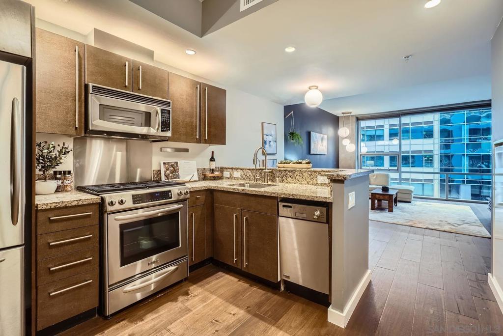 Experience upscale urban living at the iconic ICON building in downtown San Diego. This beautifully designed 1-bedroom, 1-bath condo features floor-to-ceiling windows flood the space with natural light and offer stunning views of downtown San Diego. For even more breathtaking sights, head to the rooftop deck and take in panoramic views of Petco Park. Enjoy the peace of mind that comes with a controlled-access lobby staffed 24/7, and take advantage of a designated parking space in the garage just steps from your door. ICON's HOA provides a well-rounded lifestyle with unparalleled amenities, including a deluxe full-size gym, theater, and roof top fire pit. Google Fiber Internet is included in the HOA. This condo is in a prime location and truly defines luxury city living.