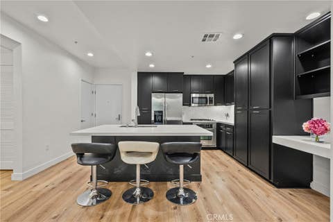Photo of 21301 Erwin Street #206, Woodland Hills, CA 91367 (MLS # SR26100315)