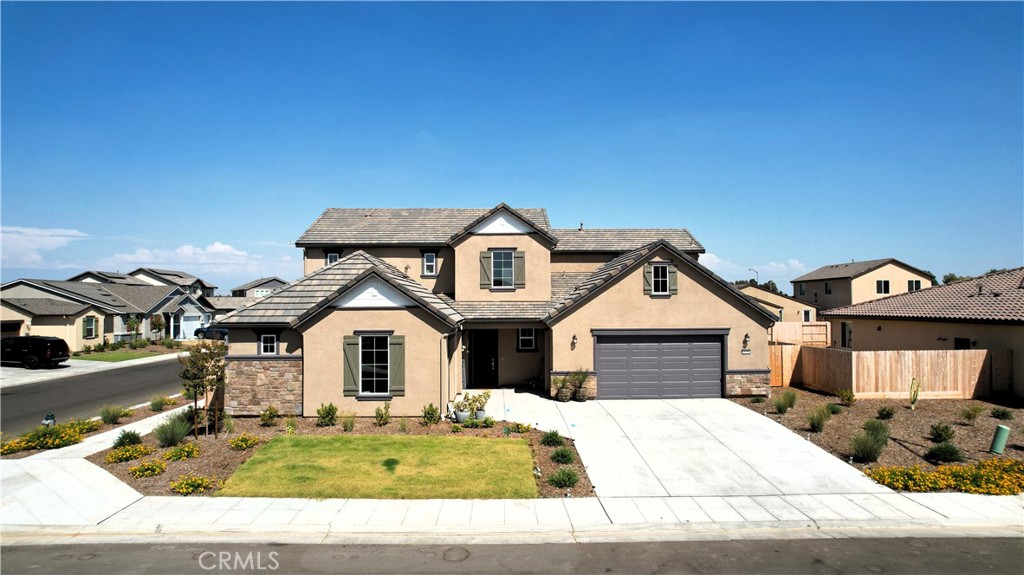 Welcome Home! This radiant 4-bedroom, 3.5-bath stunner rests on one of the largest corner lots in the neighborhood and features a spacious 3-car garage, perfect for your vehicles, gear, or workshop dreams. Located in a picturesque neighborhood served by Clovis Unified School District, it blends top-tier education with curb appeal and undeniable community pride. From the wide, welcoming streets to the peaceful community vibe, this one feels like home from the moment you arrive.
Soaring ceilings and sun-kissed interiors greet you at the door. The spacious Primary Suite includes an oversized walk-in closet and a large en-suite bath with dual vanities for peak functionality and comfort. A versatile flex room awaits your dream office, home gym, creative retreat or even a potential 5th bedroom.
The chef-inspired kitchen delivers on every level, stone counters, stainless steel gas appliances, and more cabinetry than you'll know what to do with. Entertain in your formal living room, host cozy nights in the family room, or simply enjoy the smart layout with a conveniently located powder room.
Upstairs features a massive loft, ideal for movie nights, hobbies, or play. A large Secondary Suite with own private full bath, and two additional bedrooms serviced by a third full bath, round out the perfect floor plan.
Outside, the yard is a blank slate, ready for a garden, pool, or your backyard masterpiece.
This is more than must-see. It's a must-experience.