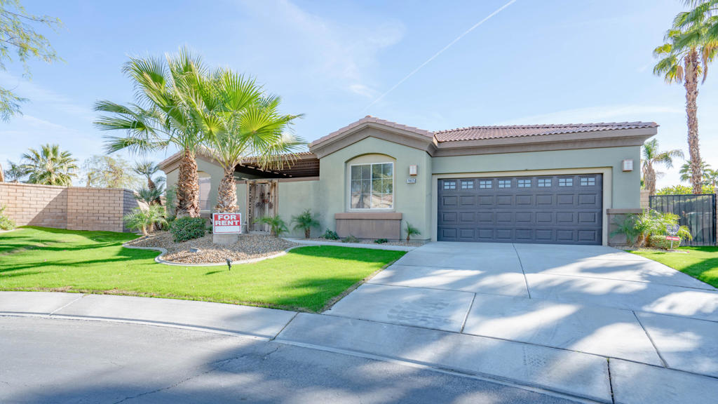 In the serene confines of the gated Esplanade community in La Quinta, this expansive 3-bedroom, 3-bathroom residence with an additional separate office space, which can effortlessly double as a fourth bedroom. Occupying a prime cul-de-sac location, the property spans almost half an acre of artfully landscaped beauty. From the sophisticated kitchen--embellished with sleek GE Profile stainless steel appliances, a modern sink, and lustrous granite countertops--to the plush carpeting and elegant travertine flooring, every corner of this residence emanates meticulous attention to detail. The 750 sq. ft. covered rear patio is an entertainer's dream. Whether you're hosting a cozy evening with friends or enjoying a tranquil afternoon, the patio's integrated cable TV hook-ups, ambient ceiling fans, and sound system connections ensure a delightful experience. Large crown molding and striking 5-1/2' baseboards, elevate the home's aesthetic. For the audiophile in you, bring your sound equipment, the property is outfitted with 7.1 Surround Sound speakers in the living area, with individual speakers in each room. A fresh, custom paint job inside and new paint on the exterior, along with large French doors, overlooking a brand-new large paver patio around the custom pool. Spacious closets peppered throughout and a duo of walk-in closets adorning the master bedroom. Also includes a large private front, covered patio and includes a spacious two car garage.