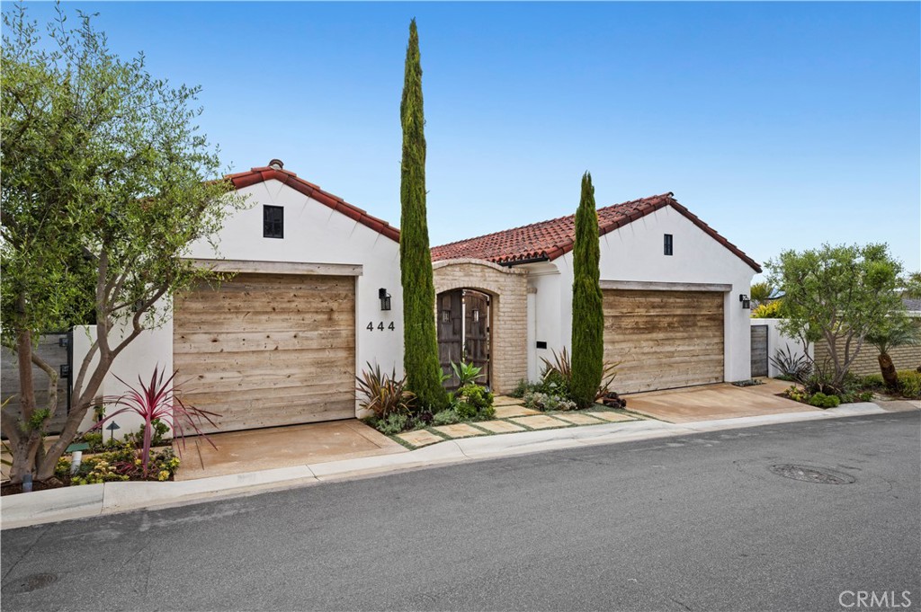 Atop the exclusive Corona Highlands community, this masterfully rebuilt coastal retreat showcases sweeping Catalina, ocean, and city views. Beyond a striking façade, the home offers four bedrooms (one currently utilized as a fitness room), a versatile game room, a library, and 4.5 baths. Refined interiors blend soaring beamed ceilings, stacked stone accents, and natural textures for a relaxed yet elevated aesthetic. Walls of glass frame panoramic vistas, while multiple private patios, a resort-style pool and spa, and a sun deck create a seamless indoor-outdoor lifestyle. The fully furnished residence features a living room anchored by a stacked masonry fireplace, a kitchen with a wood breakfast bar, honed counters, abundant cabinetry, dual ovens, a butler’s pantry with prepping sink, and an adjacent private BBQ area. The home’s amenities are thoughtfully designed for everyday luxury, including a private sauna, an individual laundry room with sink and extensive cabinetry, and an outdoor shower. A poolside entertainer’s room—with a full wet bar and pool table—completes the ultimate coastal experience.