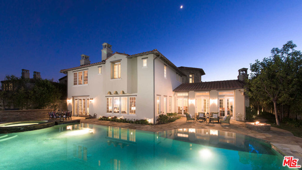 An awe-inspiring Mediterranean Tuscan villa situated behind the gates at The Oaks in Calabasas. This master's plan sits high atop an elevation and opens to beautiful endless views of the Calabasas skyline. Rarely offered, this view estate is highly updated and meticulously maintained throughout. A beautiful chateau courtyard welcomes one to an incredible grand entry and straight into the open floor plan, with the bright energy exuding into every space. The great room includes a beautifully scaled, large living and dining space, updated flooring, high ceilings and bright French doors that lead into the incredible outdoors. The kitchen has been beautifully updated and extended to a spacious breakfast dinette space, which flows into the family room. There are five spacious en-suite bedrooms including one on the main level. Two staircases for convenient access to the second floor. The master suite is grand with an extended retreat and fireplace, a spacious master spa timelessly updated and maintained extensively. Each guest suite is spacious equipped with its own bathroom and closet space. There is a second-level living room, spacious and perfect for guests. A detached casita in the courtyard also offers a perfect extended den or office space with private entry. A beautiful and rare view estate with every detail accounted for.