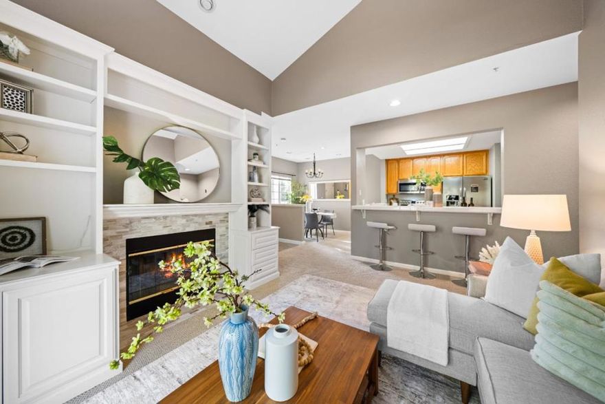 Welcome to this beautifully located top-floor unit in the desirable Hastings Shore community! This serene 2-bedroom, 2-bath end-unit features high ceilings and abundant natural light, creating a bright and airy atmosphere. The open living and dining areas include a cozy fireplace and built-in shelving. The spacious primary suite offers a dual-sink master bathroom and direct access to your private patio, while the second bedroom also enjoys partial water views. The kitchen is fully equipped with modern appliances, and in-unit washer and dryer add extra convenience. A 1-car detached garage with additional storage completes this wonderful home. Residents benefit from community amenities including a sparkling pool, relaxing spa, lush landscaping, and the Bay Trail just steps away. A short walk brings you to The Marketplace at Redwood Shores with Nob Hill Foods, restaurants, cafes, and banking. Excellent schools are nearby, and easy access to Highway 101 makes commuting to Silicon Valley, San Francisco, Oracle, and other major employers a breeze. This home offers the perfect balance of comfort, convenience, and tranquility in a prime lakeside location.