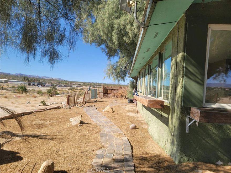 Discover a property full of potential at 3790 Adobe Rd, Twentynine Palms! Situated on 1.22 acres of mostly flat, buildable land, this 1-bedroom + bonus room, 1-bath home offers 972 sqft of living space and endless opportunity to expand or customize.

Inside, you’ll find a cozy living area with a fireplace, a functional floor plan, and plenty of natural light. The home is in need of repairs and TLC, making it a great option for investors, builders, or creative buyers ready to bring their vision to life.

Enjoy the peace and privacy of wide-open desert living while still being close to downtown amenities, the Marine Corps Base, and Joshua Tree National Park — all just minutes away. With its spacious lot, versatile zoning potential, and classic desert charm, this property is ready to become something truly special.

Come explore the possibilities and imagine the value you can create on this incredible piece of land!
