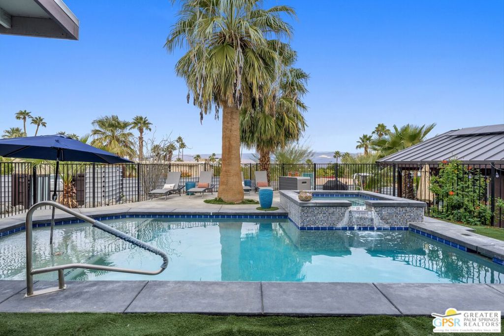 Spectacular Mid-Century home, located high up in the Cathedral City Cove. Owner prefers LONG TERM (1 year+) lease, and prefers to offer the home FURNISHED. However, shorter terms may be considered at an additional cost (Please reach out for details). This 2 bed, 2 bath highly upgraded home has been enhanced to enjoy that indoor/outdoor lifestyle the Coachella Valley is famous for. One can start their day relaxing on a chaise lounge under the covered patio, enjoying the sun rise over the nearby mountains. The custom pool/spa, occasionally shared with the owners living next door in the ADU, creates a tranquil, resort-like setting & the baja shelf w/ umbrella allows for lounging in the pool. Open the slider doors to enjoy the calming sounds of the waterfall. A spectacular eat-in kitchen features ample storage, upgraded appliances/range, add'l under counter refrigerator, and large walnut island. Outdoor bbq is conveniently located just steps away. Separate living and family rooms feature views of the pool. Cozy room off the kitchen features custom woodwork, direct rear yard access, and is a great place to read a book or curl up with your laptop. Indoor laundry closet features side by side units. The spacious primary suite features beautiful views and direct access to the pool. Primary bath features a contemporary dark paint, luxurious glass shower and dual sinks. Secondary bedroom is also spacious, with close access to the guest bath w/shower & tub. Large carport for 2 cars (electric vehicle charging station included & home is on solar!) and additional storage, as well as add'l parking in the driveway. If you're looking for a highly customized, stunning home only 15 minutes away from Palm Springs, give this one a look! Perfect for those that don't mind sharing the pool on occasion. Like detached luxury condo living, except in this case, you only share the pool with one unit, instead of many (priced accordingly)! Utilities paid as flat $675 fee each month + overages (tenant responsible for any bills over $300). Pets may be considered on a case by case basis.