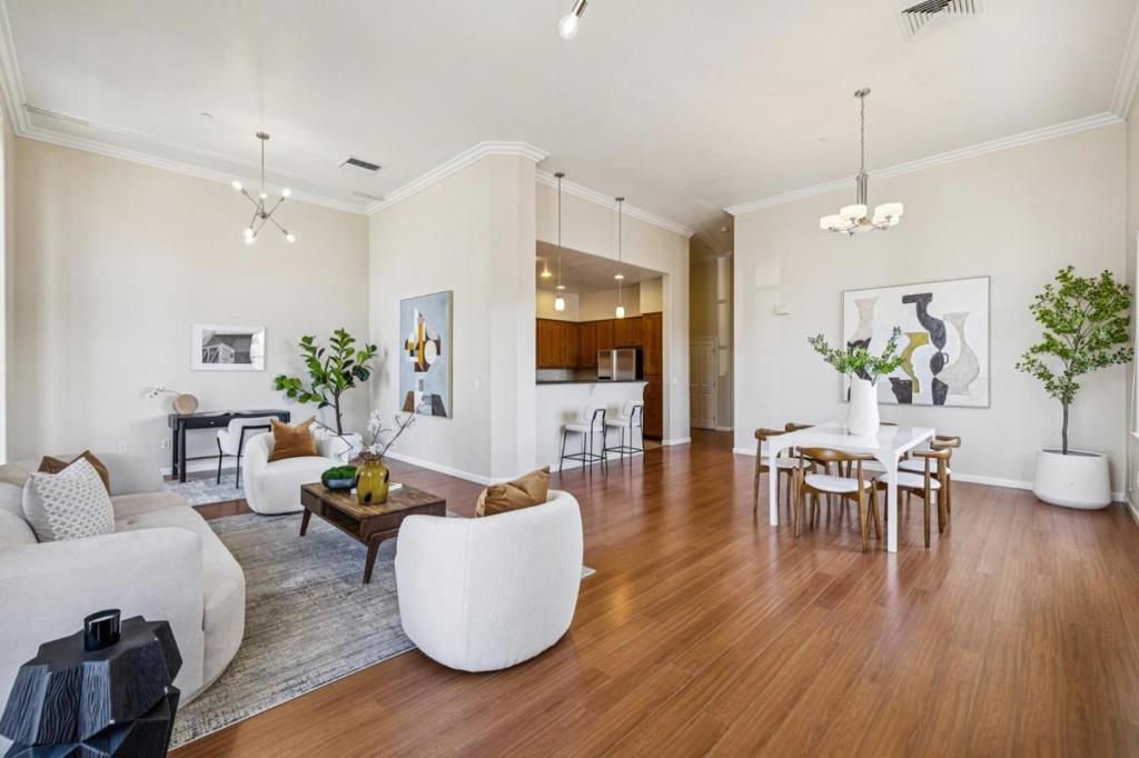Welcome to this beautiful, garden-level condo in the highly sought-after Park Broadway gated community. Bright, spacious, and meticulously maintained, this 3BR/2BA home spans 1,853 sq ft and offers the perfect blend of style and comfort. High ceilings and an abundance of natural light create an airy, open ambiance throughout. The open-concept kitchen dazzles with sleek countertops, stainless steel appliances, and a breakfast bar that flows effortlessly into the dining and living areas-ideal for entertaining or relaxing in style. The luxurious primary suite features a spa-inspired bath with dual vanities, a soaking tub, a stall shower, and a generous walk-in closet. Two additional bedrooms, a full bath, and in-unit laundry tucked into a wide closet complete the layout. Enjoy resort-style amenities including secured entry, elevator and wheelchair access, a relaxing jacuzzi, BBQs in a lush courtyard, a full fitness center, two deeded side-by-side garage parking spots, and private storage. Just steps from vibrant downtown Millbrae's dining, shopping, and top-rated schools, and minutes to BART, Caltrain, SFO, and HWY 101/280. This is elevated urban living at its finest-don't miss your chance to own a slice of luxury on the Peninsula!