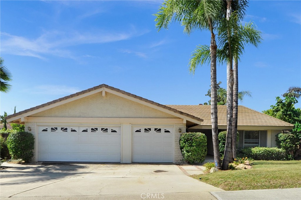 Charming single-story home in North Upland with mature fruit trees and thoughtful updates tucked away on a peaceful and secluded street north of the 210 freeway. This desirable home offers easy access to nearby schools, shopping and the scenic Foothills. The spacious layout opens with double doors leading to a beautiful foyer, living room, and family room featuring elegant crema marfil marble floors, plus a floor-to-ceiling marble fire place that adds a touch of luxury, while the wet bar creates an inviting space for entertaining. The updated kitchen includes granite countertops, newer cabinetry, and stainless steel appliances. The main bedroom opens directly to the backyard pool and spa area, with a covered patio ideal for indoor-outdoor entertaining. There are three additional bedrooms and hallway bathrooms, plus an interior laundry room with direct access to a three-car-garage. The single garage has been converted (unpermitted) into a bonus room with a closet-perfect as an office, guest space, or playroom. The backyard is a gardener's delight, featuring a large covered patio, a unique swimming pool and spa that has recently been upgraded with new plaster, tile and pool equipment in addition to a thriving collection of fruit-bearing trees-including orange, tangerine, sweet lemon (Citrus limetta), grapefruit, avocado, fig, nectarine, pomeganate, and a grapevine. The owners have invested years into improving the soil through composting and landscape care, including the removal of large rocks and the installation of a small rose garden in front of the home that blooms beautifully in season. This unique North Upland property offers comfort and an abundance of natural beauty.