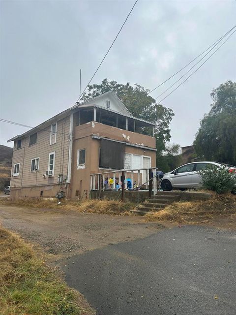 Photo of 176 Olive St St, Lake Elsinore, CA 92530 (MLS # 250042311SD)