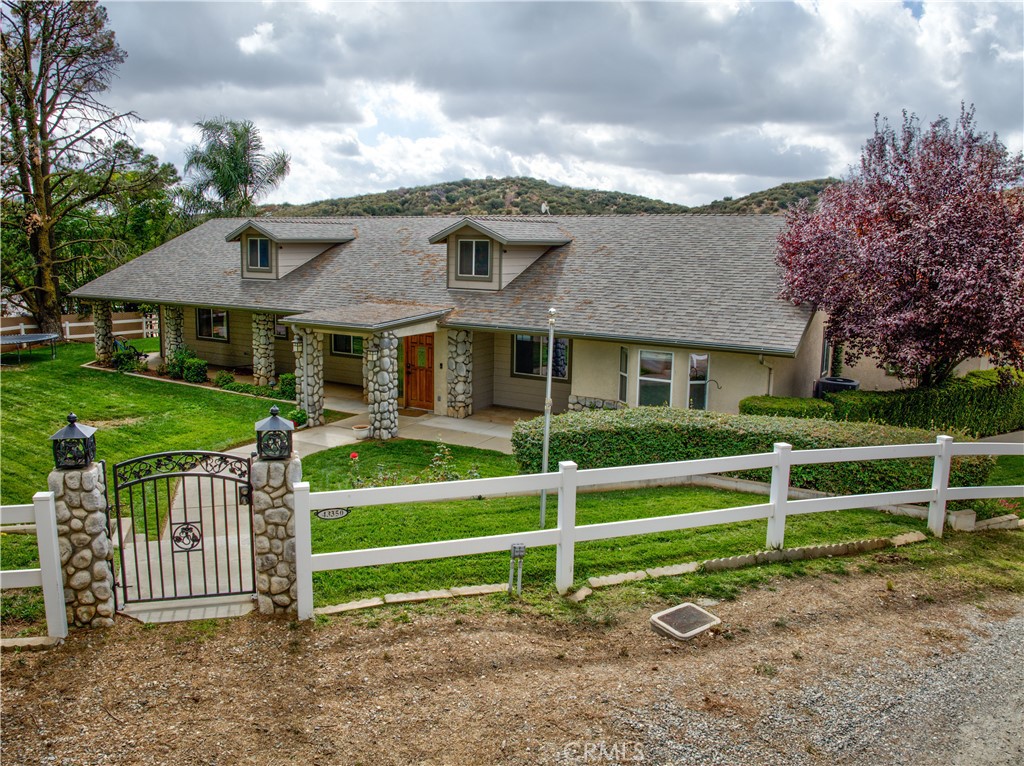 Custom-built beauty nested at the end of a quiet street! Your very own retreat away from everything, yet close to it all. Travel a few miles into the foothills from I-10 between Palm Springs and Riverside and escape to over one-half acre of privacy and solitude. Enjoy spectacular views of nature and wildlife out of your kitchen window. And that kitchen...oh it's a stunner as well. Huge island, gorgeous counters and appliances PLUS tons of storage space and a walk in pantry! Did I mention there is a pellet-ice maker?? Fill that Stanley full of ice and step outside to cool off in your very own salt-water pool or warm up in the hot-tub. In addition to 4 spacious bedrooms, multiple living areas allow for formal and casual spaces or dedicated office. 3-car garage on side of home.