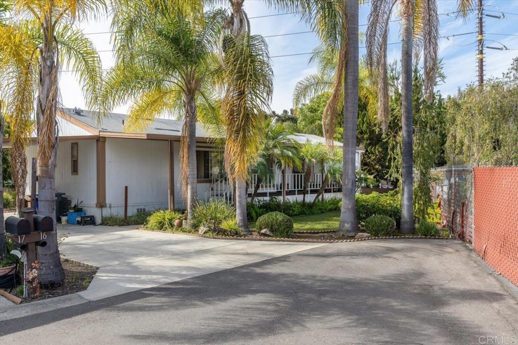 Beautifully landscaped front yard and back, unique to this manufactured home property. The front room is a den however easily converted to another bedroom with a dresser. Home does need some updating that being said the layout serves well for entertaining.