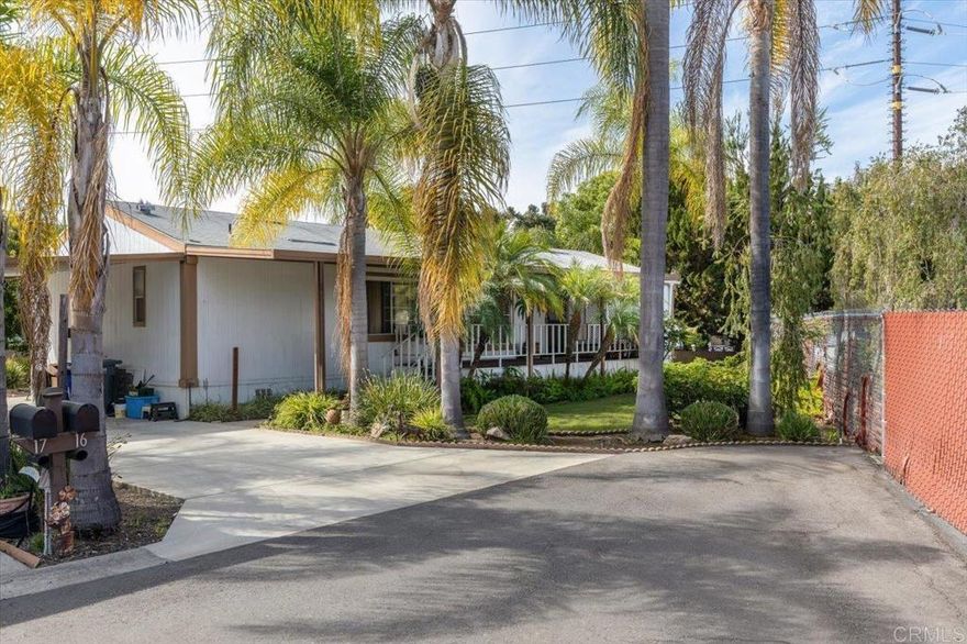 Beautifully landscaped front yard and back, unique to this manufactured home property.  The front room is a den however easily converted to another bedroom with a dresser.   Home does need some updating that being said the layout serves well for entertaining.