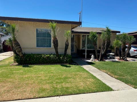 Photo of 1203 S CASTLEGATE Avenue, Compton, CA 90221 (MLS # RS26178687)