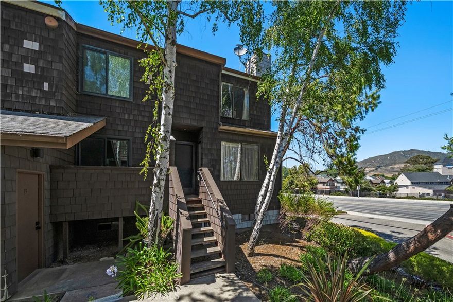 Seller is now offering a $6,000 credit towards choice of interest rate buy down, closing costs, or 1st year of HOA dues on this condo in Cedarwood, a desirable community in San Luis Obispo offering low maintenance living adjacent the Laguna Lake Golf Course. This two-bedroom, one-and-a-half-bath condominium is a great opportunity for first-time homebuyers or those looking for a turnkey second home, with 1,130 square feet of comfortable space and easy access to the Irish Hills Natural Reserve, schools, shopping, and dining. With the scenic backdrop of Cerro San Luis, the main level features a spacious living room with a cozy fireplace and charming mantel, a well-equipped kitchen, a convenient powder room, and a welcoming dining area—perfect for gathering with friends or enjoying a relaxed meal at home. The kitchen is light and bright, featuring a sunny window over the sink, ample counter space and storage, a breakfast bar, pantry, and quality appliances: Amana dishwasher, GE electric range, Whirlpool microwave, and an included Kenmore refrigerator. Upstairs, the expansive primary bedroom includes a generous walk-in closet and a cozy seating area—ideal for reading, relaxing, or unwinding at the end of the day. The second bedroom offers flexibility for guests and can be re-imagined as a home office. A full bathroom completes the upper level. Additional highlights include a washer and electric dryer, a tandem two-car garage—giving you extra space for storing mountain bikes and surfboards after a day exploring the Central Coast—plus an assigned parking spot for added convenience. Residents also enjoy community amenities such as a clubhouse and picnic area. With a prime location and a functional floor plan, this move-in ready condo is a great opportunity to enjoy the SLO lifestyle.