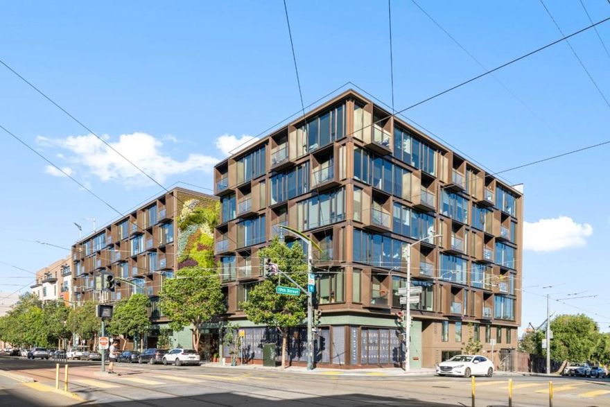 Designed by Woods Bagot, this modern top-floor 2-bedroom, 2-bathroom condo features valet parking, offering Waterfront living in the heart of Dogpatch. The open-concept floor plan features expansive wall to wall windows and a balcony, bathing the space with natural light. European oak hardwood flooring adds warmth and elegance. Beautiful open kitchen features gorgeous marble countertops, custom Italian cabinets, upscale integrated Miele appliances and a spacious island with seating. The primary suite offers a large custom walk-in closet and a luxurious ensuite bath with dual marble vanities, Kohler fixtures and a glass-enclosed shower with marble walls. The second bedroom is generously sized, featuring a walk-in closet. The hallway bathroom boasts a gorgeous soaking tub. Inside laundry with Miele washer and dryer. Community amenities boast a landscaped center courtyard, private gym, rooftop terrace, pet spa, residence lounge and co-working space. This unit comes with one assigned parking space, two designated bike storage areas, and one owned storage space. Great location with close proximity to Crane Cove Park, coffee shops, popular restaurants, Dogpatch Boulders, Caltrain, Chase Center, Restoration Hardware and the future Pier 70 development, and more!