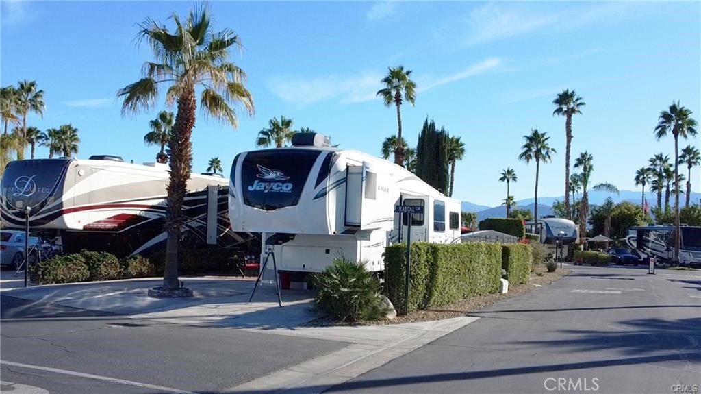 Listed Here is the Complete Package of Grant Deed Land in Desert Shadows RV Resort Packaged with this luxurious Jayco 28.5RSTS 5th Wheel! One of the best views in the resort! complete with a Storage/Shop Shed of the highest quality! Desert Shadows RV Resort offers 2 large & well-maintained clubhouses plus 3 additional satellite clubhouses, An indoor pool with a large spa and sauna, An olympic-size lap pool, A total of 6 pools, 5 spas and 3 saunas, Sunken, lighted tennis courts, 8 Pickle-ball courts, An indoor shuffleboard pavilion, 16,000-square foot San Jacinto room with floating hardwood dance floor, and a professional stage, plus a large kitchen, A 3,000-square foot “Our Gang” party room and lounge with a giant fireplace and kitchen, A huge party terrace with mountain views, A fully equipped fitness center, A dance studio, Library, Billiards room, Horseshoe pits, Several laundries, restrooms and bath facilities, Card & hobby rooms with Pottery Kiln, A putting green, Organized fitness activities, Daily activities including dances, dinners and entertainment, Wi-Fi and wired broadband Internet access. Close to everything! The Best Kept Secret in Coachella Valley! Must See this Resort! Luxurious 2021 5th Wheel available as a package!