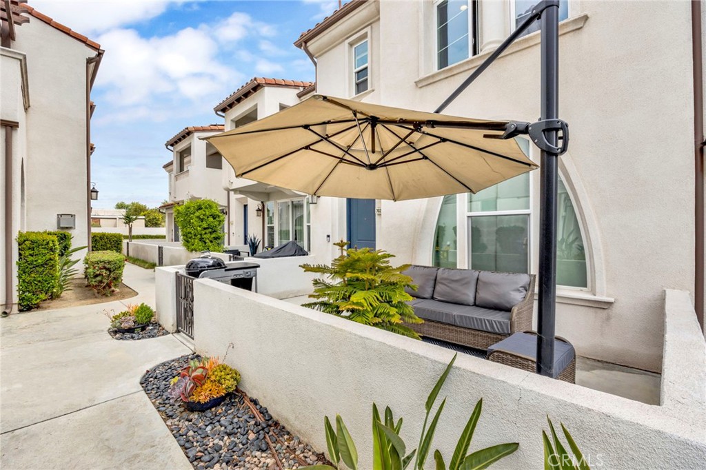 Nestled in the heart of Pico Rivera, this contemporary 3-bedroom, 3-bathroom condo offers a harmonious blend of style and functionality. The open-concept living area features a cozy fireplace, seamlessly flowing into a kitchen adorned with modern cabinetry and ample counter space. Upstairs, the expansive master suite boasts a walk-in closet and a private balcony, providing a serene retreat. Two additional well-sized bedrooms offer generous closet space and natural light. Laminate flooring throughout adds a touch of elegance and ease of maintenance. Enjoy outdoor living with a gated front patio and a second private patio accessible via sliding doors—ideal for relaxation or alfresco dining. Additional amenities include a 2-car garage, tankless water heater, and community solar panels covered by HOA fees, helping to keep electricity bills low. The community also offers a large swimming pool and a private entrance for added convenience. Located just 9 miles from Downtown Los Angeles and 4 miles from Whittier College, this condo is close to schools, shopping, and recreational areas, making it an ideal place to call home. This is a must see!!!