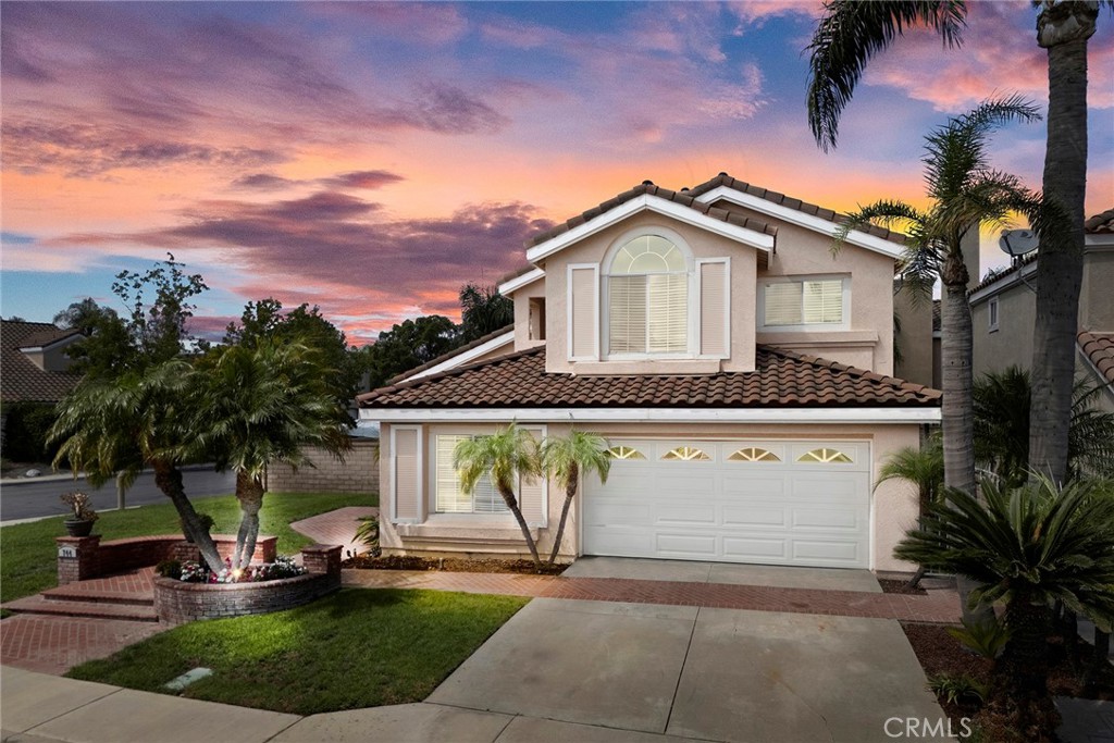Charming Anaheim Hills Gem! This immaculate corner-lot pool home in the prestigious Sycamore Canyon Community is move-in ready and available for immediate enjoyment! Convenience is key with this well-designed open floor plan featuring soaring ceilings, 4 bedrooms and 2.5 Bathrooms. This home offers a warm and inviting style that will instantly make you feel right at home.The gorgeous kitchen is appointed with granite counters, a designer tile backsplash, stainless steel appliances, new flooring, and a bright breakfast nook ideal for family meals, opening directly to a family room with cozy fireplace and sliding doors that open to the backyard. Enjoy gatherings of any kind in the elegant dining room, complemented by a formal living room with pool views. The spacious primary suite offers double-door entry, a walk-in closet, and an updated bath featuring dual sinks, marble counters and flooring, a soaking tub, and a separate shower. Indoor laundry room located downstairs. Additional highlights include new interior paint, new carpet, crown molding, skylight, recessed lighting and section 1 termite work completed. Step outside and relax in the beautifully landscaped backyard, complete with a sparkling pool, water falls and slide, spa, built-in BBQ, and covered patio—perfect for gatherings and entertaining year-round! The two-car garage includes an extra built-in storage room with direct access. Ideal location near Ronald Reagan park, Running Springs Elementary, miles of hiking and biking trails and a wide variety of shopping and dining options. Easy access to 91 fyw and 241 Toll Roads. Don’t miss this incredible home!
