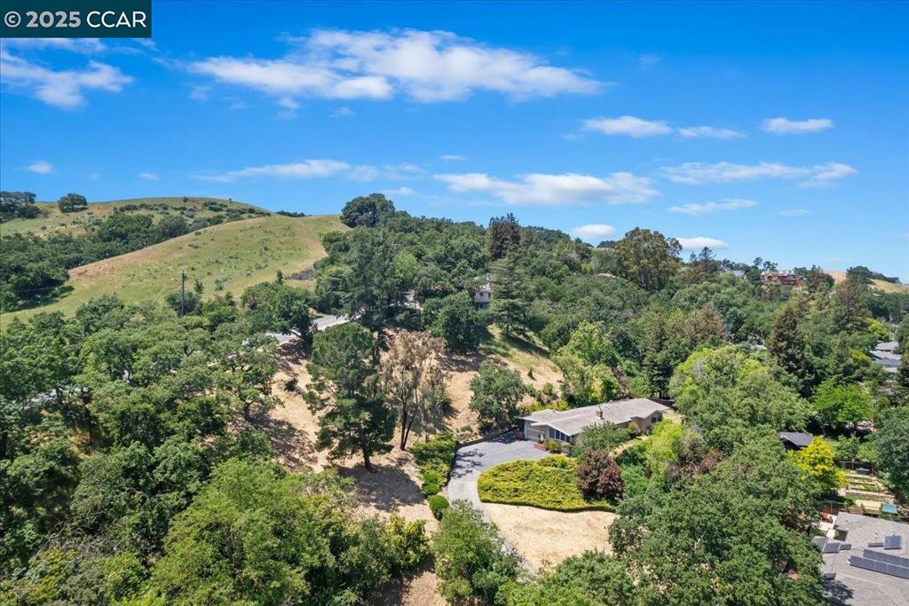 Two Parcels totaling 1.52 secluded acres with serene views of the East Bay Hills & Mt Diablo. Long term owners have lovingly maintained this home and adjacent parcel. House needs foundation work but presents a unique opportunity to create a special home and/or develop. Excellent location close to top rated schools and trails. Parcel 1 with 2,171 SF Home on 43,425 SF Lot. Parcel 2 Adjacent vacant Lot - 22,680 SF.