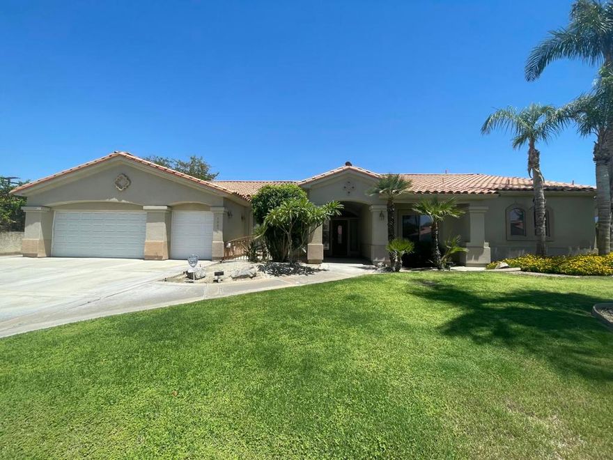 This stunning 3-bedroom, 4-bathroom home epitomizes elegance and comfort, blending luxury with modern amenities. The master suite features a spacious bedroom, a luxurious full bath with a soaking tub, dual sinks, and a walk-in closet. The two additional bedrooms each have their own ensuite 3/4 bathrooms, ensuring privacy and convenience for family or guests. An additional bonus office/library room has floor-to-ceiling cabinets/shelving with glass doors to view contents. A guest half bath is conveniently located near the front door.The grand open floor plan is highlighted by high ceilings and an elegant living room with a cozy fireplace. There are two dining areas, perfect for both formal and casual meals. The gourmet kitchen is upgraded with high-end appliances, a center island, and a hightop bar for additional seating. It boasts two dishwashers for easy cleanup and a wine cooler for the connoisseur.Step outside to an inviting pool with a waterfall feature and a spa Jacuzzi for ultimate relaxation. The grassy area is perfect for play or pets, and the built-in BBQ grill makes outdoor entertaining a breeze. Additional amenities include an extra room for laundry with a sink, a 2-car garage, and an extra garage space/door for a golf cart. The expansive driveway accommodates up to six additional guest vehicles, with a dedicated side area in the backyard perfect for a truck, larger vehicle or small camper.