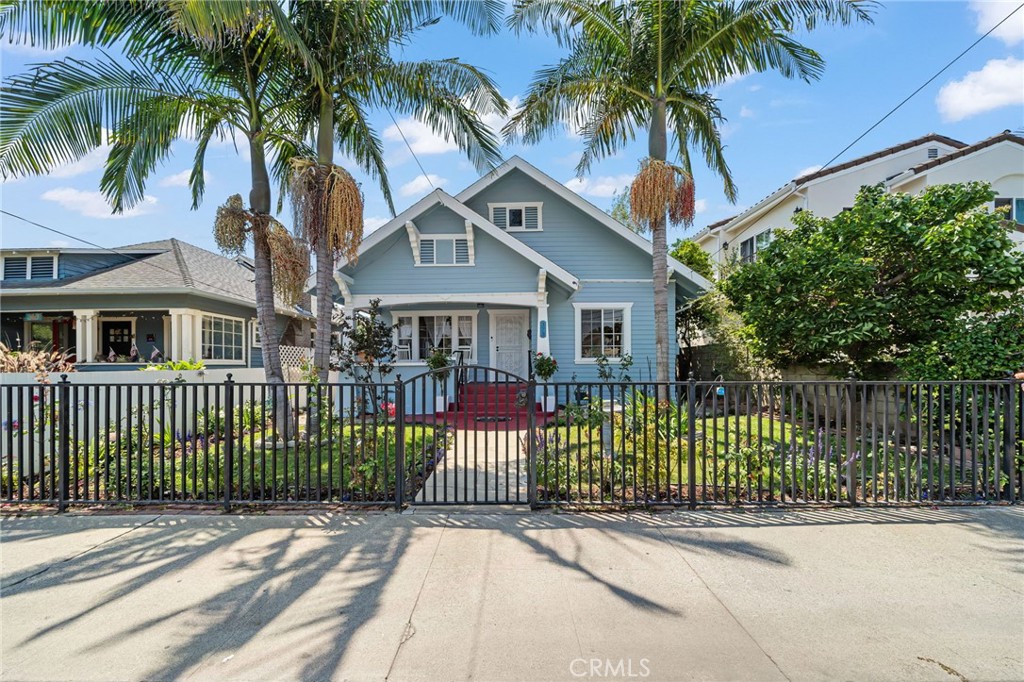 This breezy 2 bedroom 1.5 bath 1914 craftsman home boasts an open floorplan with plenty of natural light, original wood floorings, vaulted ceilings, and built-in cabinets in the dining room. Despite being located only blocks from the harbor and walking distance to downtown San Pedro and the all-new West Harbor waterfront development, this property sits on one of the quietest blocks you’ll find! The southern facing deck off the kitchen is perfect for entertaining or a relaxing dinner with friends, and with the click of a remote, the automatic gate at the rear of the property opens to allow for parking of 5-8 cars, or an RV or boat amongst the established avocado, orange, mango, and guava trees. For the investor, this property has endless possibilities to build equity, be that by finishing the attic and adding a second floor or by building an ADU in the large backyard. Whether you are looking for a home to spend the rest of your days or a property to build out and create wealth, 373 W Santa Cruz St might just be it!