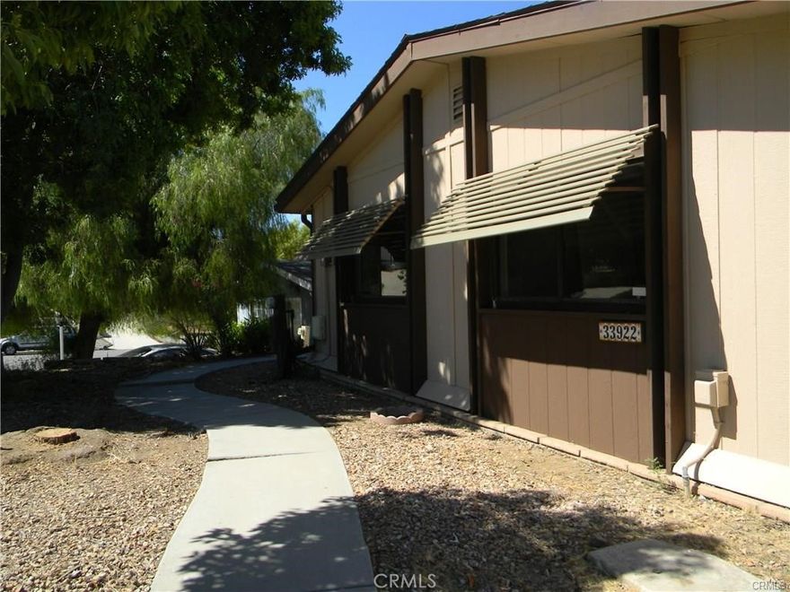FULLY REMODELED home in The Farm community. Gorgeous kitchen with 3 ft.by 6 ft. island, new cabinets, recessed lighting and custom farmhouse sink. Gas fireplace. Oversized 2 car detached garage, 30 X 20 ft. Quiet street with very little traffic and surrounded by other beautiful homes. Fenced back yard. Paid off solar panels included in the sale. Convenient to I-15 and I-215 freeways and shopping. Manufactured home on a permanent 433 foundation. No community age restrictions.
