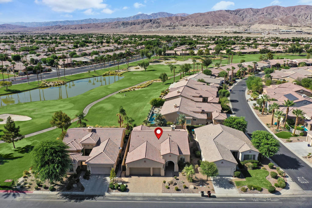Presenting this beautifully maintained and highly sought-after Castellano floor plan, offering 2,230 square feet (EST.) of elegant living space within the premier 55+ active adult community of Sun City Shadow Hills. Stunning curb appeal with finished pavers in the driveway and walkway to the entry. This home showcases spacious, light-filled interiors and a functional open-concept layout designed for both effortless relaxation and gracious entertaining. The gourmet kitchen is thoughtfully appointed with rich wood cabinetry, granite countertops, a breakfast bar, stainless steel appliances, and double ovens, ideal setting for hosting gatherings. Adjacent to the kitchen, the formal dining area and inviting breakfast nook offer flexible and refined dining options. Featuring two generously sized bedrooms, two and a half bathrooms, and a dedicated office or den, this home is perfectly suited for remote work or quiet retreat. The expansive primary suite includes dual vanities, a walk-in shower, and abundant closet space, creating a luxurious private haven. Plush carpeting enhances the warmth and comfort of the great room and bedrooms. Step outside to a tranquil backyard oasis, complete with a covered patio ideal for savoring morning coffee or unwinding at sunset next to the fire pit. Select vantage points offer delightful glimpses of the golf course. Two car garage plus golf cart garage. Conveniently located just moments from the community clubhouse, pools, fitness center, and a host of engaging social activities, this exceptional property embodies the very best of resort-style living. Sun City Shadow Hills offers the best of the best!