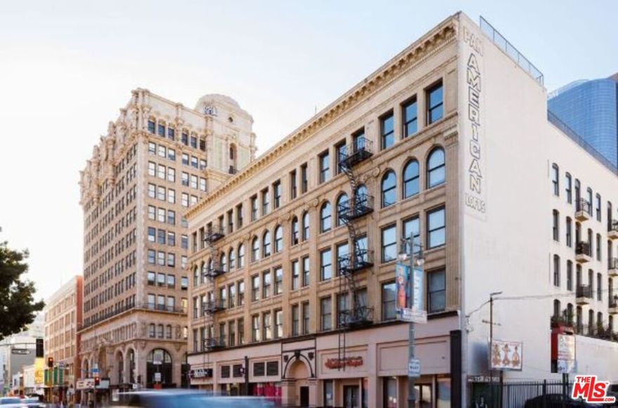 Stunningly remodeled designer LIVE/WORK loft in the famed Pan American Building. Located in the heart of DTLA, this rare double corner loft features hardwood floors, soaring ceilings, and a mix of original concrete and brick walls. The unique layout is 1110sf and features oversized double pane windows along three walls with city views, and an open plan living room with stunning chef's kitchen, complete with massive entertainer's island, stainless steel Viking appliances, and pantry with barn door. The separate bedroom features a large closet, and opens to a large private NY-style terrace. The bathroom features a rain shower, custom tiles, soaking tub and W/D tucked inside a closet. Nest thermostat system, central heat and AC, and rent includes one designated in-building garage parking space, water, trash, gas and high speed Internet.  The Pan American building features a resident courtyard, secure lobby entry, and underground parking. Enjoy within walking distance the Grand Arts Corridor with the Broad, Walt Disney Concert Hall, Neuehouse, Bradbury, Grand Central Market, Whole Foods, Blue Bottle Coffee, Maccheroni Republic, Redbird, Little Tokyo and some of the best dining and nightlife in LA!