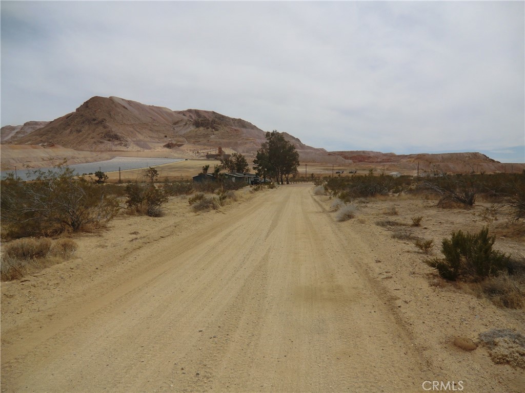 Fantastic opportunity to own a 2-acre residential lot ideally located just minutes from the 14 Freeway.
Situated off Stevenson Street, with access via a dirt road, this parcel offers beautiful desert views and
is surrounded by existing homes and structures—providing a balance of seclusion and community.
Zoned E (2 1/2), this lot is suitable for building a single-family residence with ample space for additional
improvements or recreational use. Enjoy peaceful desert living while still being within proximity
to local amenities and main thoroughfares.
APN: 427-332-06-009;
Zoning: E (2 1/2);
GPS Coordinates: 34.998051, -118.197210 ;
Buyer to verify all zoning, utility access, and building requirements with the County.