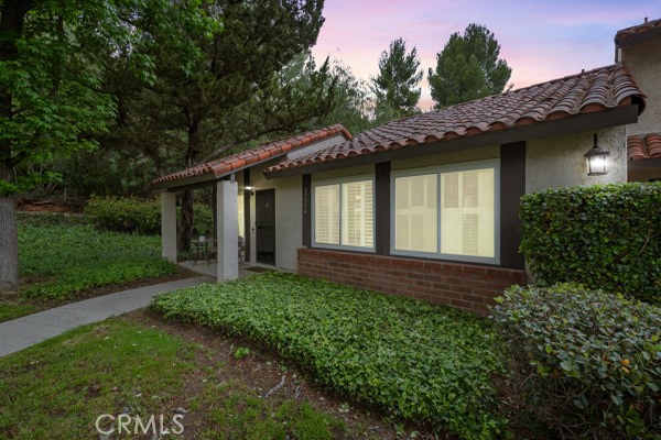 Tucked away in a serene corner of Agoura Hills, this beautifully upgraded end-unit townhome offers unmatched privacy and peaceful surroundings. Surrounded by mature pine trees and with no neighbors behind you, the private patio is the perfect place to sip your morning coffee and enjoy nature. The community is warm and inviting, with direct access to world-class hiking and biking trails in the Santa Monica Mountains—plus it’s just a short walk to the nearly completed Wildlife Bridge. Inside, you'll find a bright and welcoming space featuring recessed lighting, a stunning light fixture, and an upgraded kitchen complete with a newer dishwasher. The private laundry room offers extra convenience, while the abundant storage throughout keeps everything organized. A spacious two-car garage rounds out this move-in-ready home. With its peaceful setting, premium location, and thoughtful upgrades, this one won’t last!