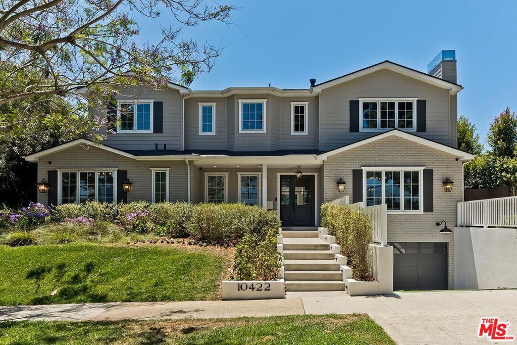 A gorgeous home built only two years ago in premier section of Cheviot Hills: 6 bedrooms/8 bath with spectacular golf course views from virtually every room. There is no other property that embodies this level of artistry, craftsmanship and scope on the market today. Sweeping, curved staircase joins the three levels of this 8216 square foot home. Intricate crown moldings and wainscoting anchored by the hardwood floors and high, coffered ceilings gives the open floor plan grace and unique personality. Formal living room with marble fireplace and golf course view; private guest suite; formal dining room and a butler's pantry that leads to the gorgeous chef's kitchen that goes beyond what one expects in a top-tier home. Oversized marble island with brass accents; quartzite countertops; Wolf 60" range; Subzero refrigerator; designer pendants; walk-in pantry with additional storage; two dishwashers and a farmhouse sink that overlooks the backyard, allowing natural light to flood the space. Accordion doors unfold to create a seamless flow from the Great Room to the backyard. Here you'll find a resort-like pool, hot tub, patio entertaining space, side courtyard- all surrounded by tall trees to ensure private tranquility. The bedrooms are each en suite with beautiful bathrooms and spacious closets - the Primary Bedroom has soaring, vaulted ceilings, fireplace, two enormous walk-in closets and an incomparable view of the golf course and beyond. The home's lower level is an entertainer's dream: luxurious screening room; social party and recreation space; tavern and wine room. Additional amenities include: stylish laundry room (with convenient chute), elevator, an abundance of storage solutions, two car garage and proximity to the award winning Overland Elementary School. A true once-in-a-lifetime opportunity to own this exceptional and unparalleled property