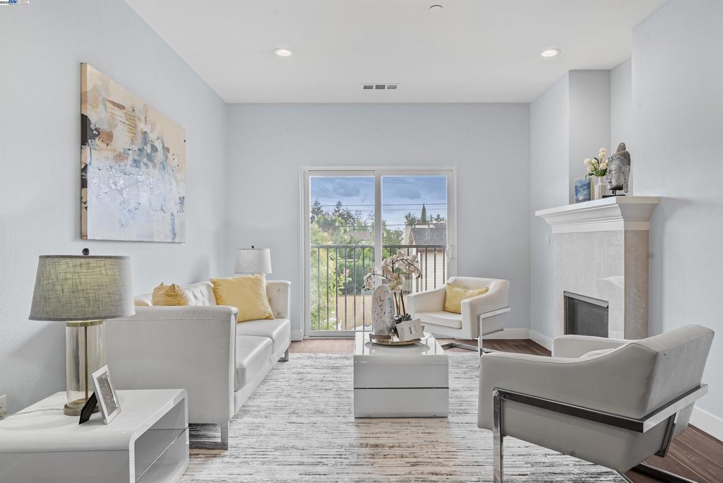 Welcome to this beautifully updated townhome in the highly sought-after Villas at Florio community, located within the top-rated Irvington High School district. Featuring 3 bedrooms, 3.5 bathrooms, and 1,818 sq. ft. of living space, this home offers comfort, style, and functionality for today’s lifestyle. Private In-Law Suite: Convenient 1 bed/1 bath on the ground floor—ideal for guests, extended family, or a home office. Open-Concept Living: Bright second floor with a spacious living room, cozy gas fireplace, and seamless flow into the dining area and kitchen. Chef’s Kitchen: Hardwood cabinetry, quartz countertops, stainless steel appliances, freestanding gas cooktop & powerful hood—perfect for cooking and entertaining. Dual Master Suites: Two generous suites on the third floor, each with walk-in closets, double windows, and elegant tile finishes. Modern Comforts: Central heating & cooling, double-pane windows, tankless water heater, newly refreshed hardwood flooring, and low HOA dues. Walk to Irvington schools, parks, shopping, library, community center, supermarkets & restaurants. Easy access to I-680, I-880, Dumbarton Bridge & BART. This home combines contemporary design, modern upgrades, and an unbeatable location—a true gem in one of Fremont’s most desirable neighborhood.