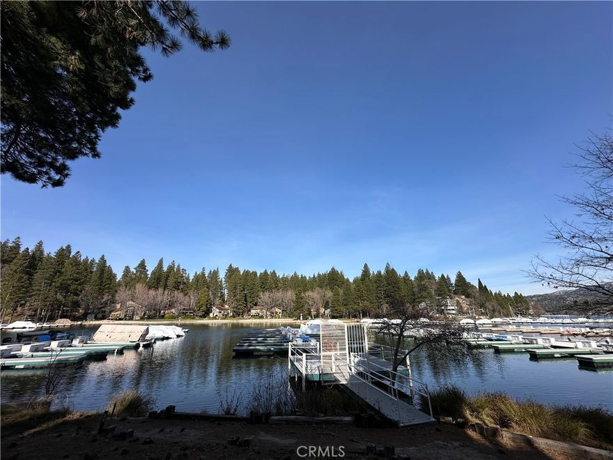 Nestled in the peaceful deep waters of Meadow Bay (according to an Association representative to be approximately 30 feet deep), this highly desirable dock slip (MBM3, Slip 15) sits between ALA Trail #36 and #35. Positioned near the end of the multislip, it offers easier parking and smooth boat maneuvering. The slip features durable Trex-style decking, private gated access, and breathtaking lake views. Conveniently located near the Village, with restrooms just steps from the entry gate, this spot makes lake days even more enjoyable. A private dock box is included for your gear. From sunrise to sunset, whether you’re enjoying water sports or simply soaking in the scenery, this is lake living at its finest.