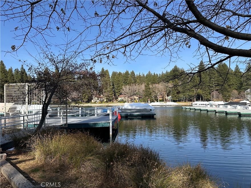 Nestled in the peaceful deep waters of Meadow Bay (according to an Association representative to be approximately 30 feet deep), this highly desirable dock slip (MBM3, Slip 15) sits between ALA Trail #36 and #35. Positioned near the end of the multislip, it offers easier parking and smooth boat maneuvering. The slip features durable Trex-style decking, private gated access, and breathtaking lake views. Conveniently located near the Village, with restrooms just steps from the entry gate, this spot makes lake days even more enjoyable. A private dock box is included for your gear. From sunrise to sunset, whether you’re enjoying water sports or simply soaking in the scenery, this is lake living at its finest.
