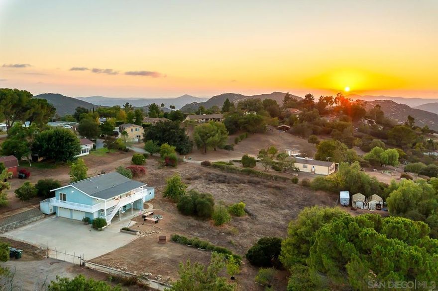 Nestled in the beautiful quiet community of North Crest near nature preserve! This beautifully remodeled home blends modern comfort with breathtaking natural beauty! Featuring 2 bed & 1 baths upstairs plus two optional bedrooms with a bathroom & kitchenette downstairs, it’s ideal for guests, extended family, or a home office setup! The stylish kitchen boasts sleek finishes, new applicances with panoramic views of the surrounding mountains & sparkling Lake Jennings! A spacious covered wraparound deck invites you to enjoy sunrise coffee, sunset dinners or hot tub relaxing & starlit evenings~ Views for Miles & Miles!  Situated on 1.16 flat usable acres, the property offers plenty of room to entertain, has many fruit trees, garden or horses. Additional highlights include a new heating and air conditioning system, a 3+ car garage with laundry hookups, and ample concrete parking for your RV, boat, or toys. The solar system is paid in full! Country living, city close!