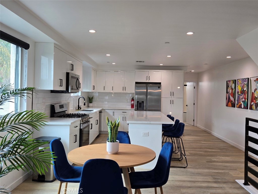 Experience comfortable and convenient living in this private bedroom with its own bathroom, located in a thoughtfully updated home in East Hollywood. This bright and spacious room features hardwood floors, ample closet space, and large windows that invite natural light. Residents enjoy access to a modern shared kitchen, as well as in-unit washer and dryer for added convenience. Ideally situated near Los Feliz, Silver Lake, and Koreatown, the property offers easy access to public transportation, shops, restaurants, and local hotspots. A perfect blend of privacy and community in a vibrant, central location.